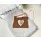 Photo of Copper I Love Oregon Ornament with Heart shape cutout in the middle and an Oregon Sunstone gemstone, shown with muslin gift bag